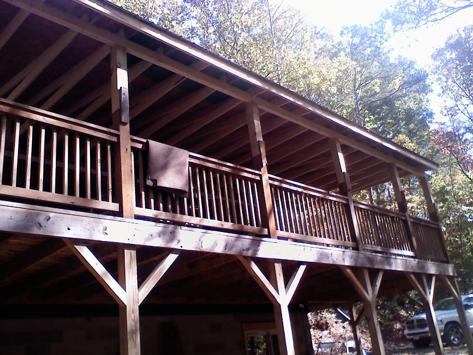 Timber framing under a new elevated porch and deck — Roof Leak Repair in East Weymouth by Roofing Brothers